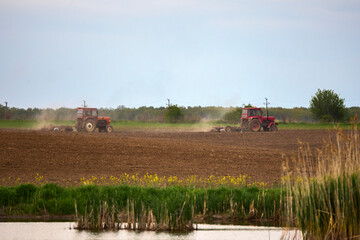 Fototapeta premium a tractor that works the land to be cultivated