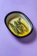 Fried asparagus with butter and wine