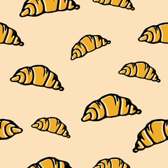 Cute colored seamless pattern with croissants on pink background for textile, fabric design or wrapping paper