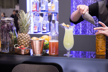 Cocktails with various alcoholic drinks at the bar.