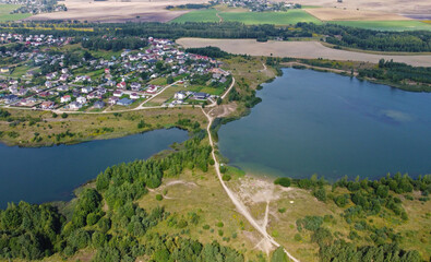 Fototapeta na wymiar Aerial view of a beautiful suburban lake in an expensive elite neighborhood