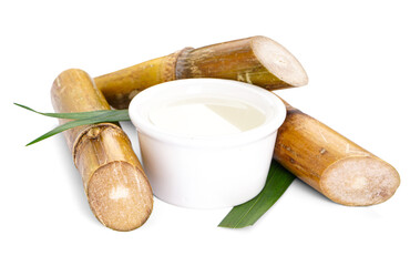 Sugar cane juice and sugar cane isolated on white background.