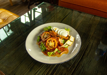 Muslim salad with sauce on wood table