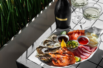 Assorted sashimi and prosecco