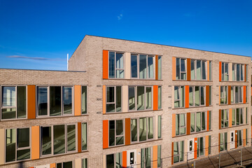 Final construction phase showing exterior facade aerial of real estate investment project. Dutch engineering real estate investment urban development