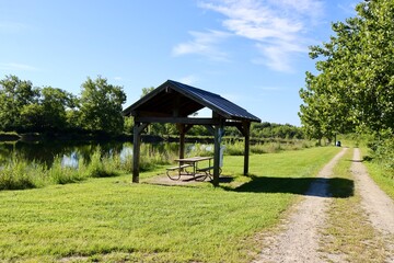 The old wood shelter in the park on a sunny day.