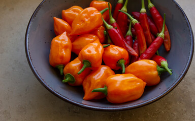 orange and red chili in a bowl
