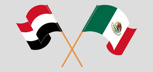 Crossed and waving flags of Yemen and Mexico