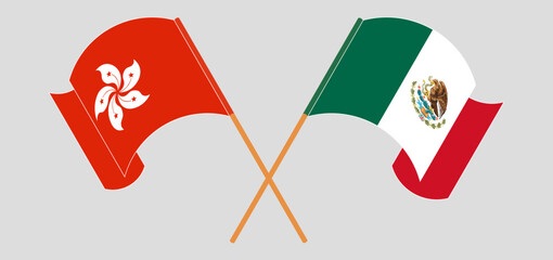 Crossed and waving flags of Hong Kong and Mexico