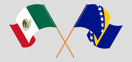 Crossed and waving flags of Mexico and Bosnia and Herzegovina