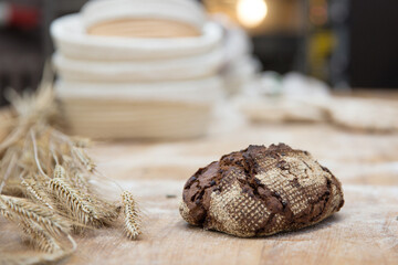 Baker carrying a tray of freshly baked bread