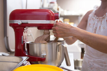 Baker forming dough for baking bread