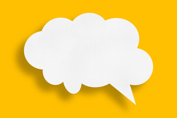 white cloud paper speech bubble shape against yellow background - obrazy, fototapety, plakaty