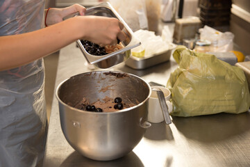 Baker forming dough for baking bread