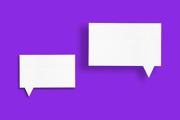 white paper with speech bubbles isolated on purple background
