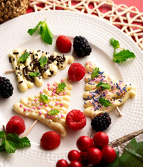 Christmas trees made with white chocolate and colored chocolate chips. creative recipe.