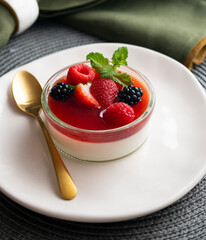 Italian panna cotta with red berries. Blackberries, strawberries and raspberries. Traditional Italian recipe.
