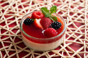 Italian panna cotta with red berries. Blackberries, strawberries and raspberries. Traditional Italian recipe.