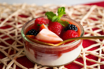 Italian panna cotta with red berries. Blackberries, strawberries and raspberries. Traditional Italian recipe.