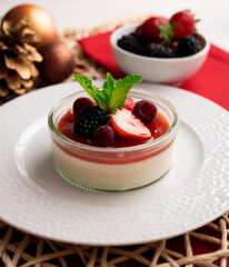 Italian panna cotta with red berries. Blackberries, strawberries and raspberries. Traditional...