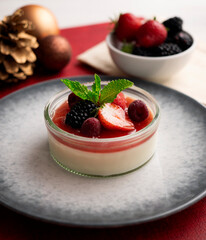 Italian panna cotta with red berries. Blackberries, strawberries and raspberries. Traditional Italian recipe.