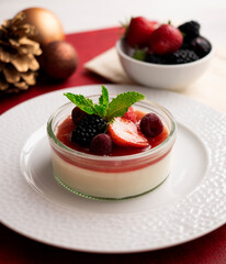 Italian panna cotta with red berries. Blackberries, strawberries and raspberries. Traditional...