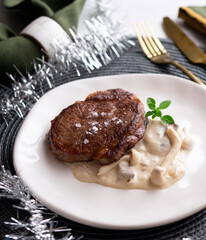 Beef tenderloin with mushroom sauce. Traditional Spanish recipe.