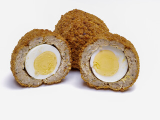 Scotch Eggs  halved isolated on a white background
