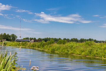 Landscape with Beilervaart and transmission tower Smilde in the backgroundThe Netherlands