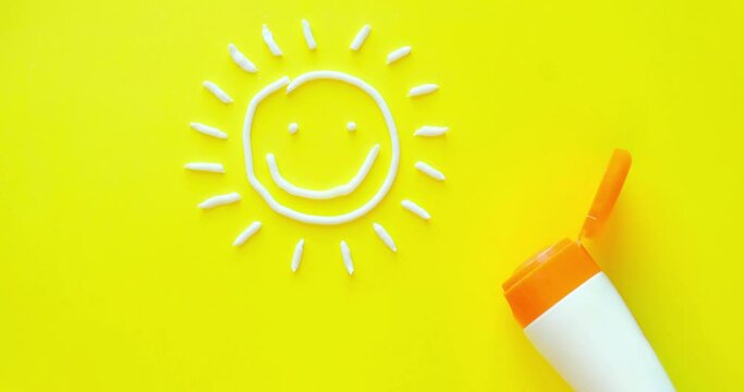 Sun with smiling face from sunscreen. Looped 4K stop motion animation on a solid yellow background
