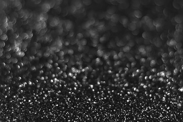 Gray black sparkling glitter bokeh background, christmas abstract defocused texture. Holiday lights. Snowy shiny sparkle stars for celebrate