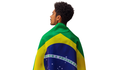 September seven, Brazil Independence Day. Black man holds Brazilian flag isolated.