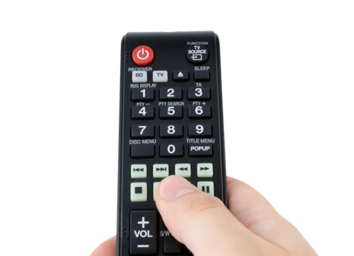 Hand holding remote control, isolated - Powered by Adobe