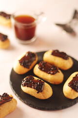 Traditional French dessert - eclairs with a cup of coffee	