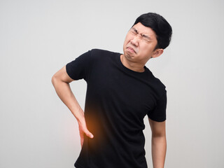 Young man feels pain his waist from office syndrome