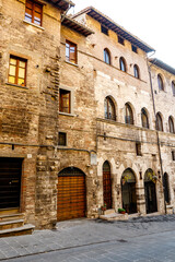 Fototapeta na wymiar Facades of medieval houses in the center of Gubbio, Umbria, Italy, Europe