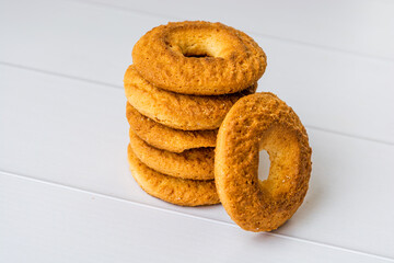 industrialized cookies stacked on white wooden table