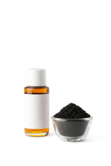 black seeds in small glass bowl and black seed oil bottle with blank label, also known as black cumin or caraway or kalonji, isolated on white background, mock-up template