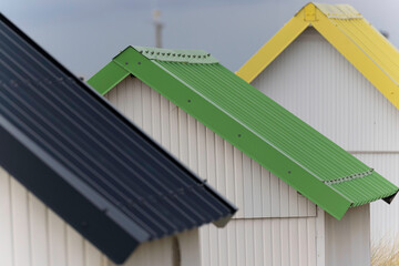 Beach cabins in Gouville sur Mer, Manche, Normandy, France in various lights