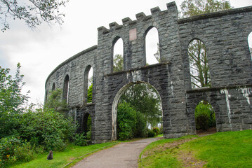 Lancet arches of McCaig's Tower aka McCaig's Folly prominent tower built of Bonawe granite on Battery Hill overlooking the town of Oban in Argyll, Scotland, UK