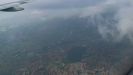 Fototapeta na wymiar Flying Above Birds’ Eye View Through Clouds At Bangalore Karnataka India