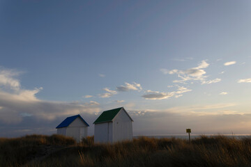 Beach cabins in Gouville sur Mer, Manche, Normandy, France in various lights