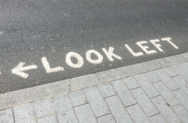 Look left, written at a pedestrian crossing in London, UK