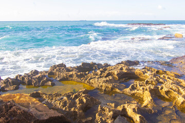 Big waves of the Mediterranean sea roll in at the rocky Beach of the western side of Arwad (Arados) in Syria, on a cold yet sunny winter morning. - Image