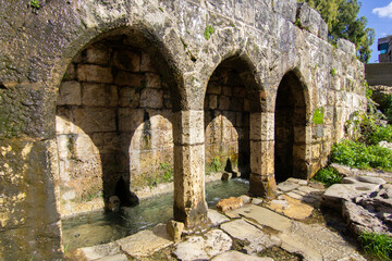 Fototapeta na wymiar Ancient water, mountain spring built of stone brick in the mountains of Tartous city, Syria.