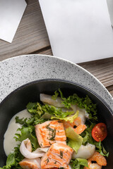 Salmon steak, squid, shrimp with salad to the New Year's table. Top view, macro