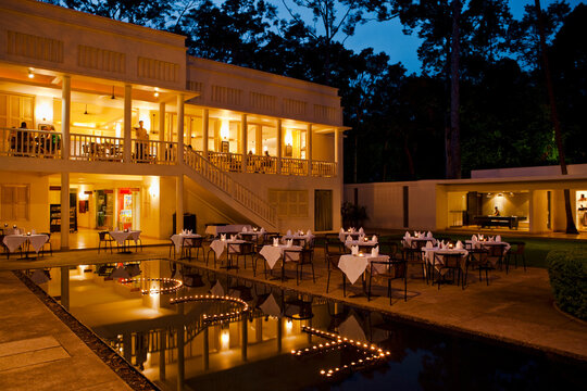 At dusk, an Angkor Wat hotel is set for dinner, Siem Reap, Cambodia.