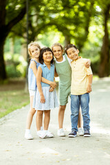 Fototapeta premium Group of asian and caucasian kids having fun in the park