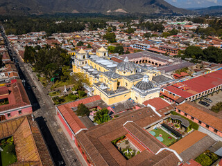 Beautiful aerial cinematic footage of the Antigua City in Guatemala, Its yellow church, the Santa...