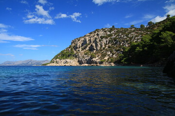 Fototapeta na wymiar Clean Adriatic Sea and mountain peaks in Croatia